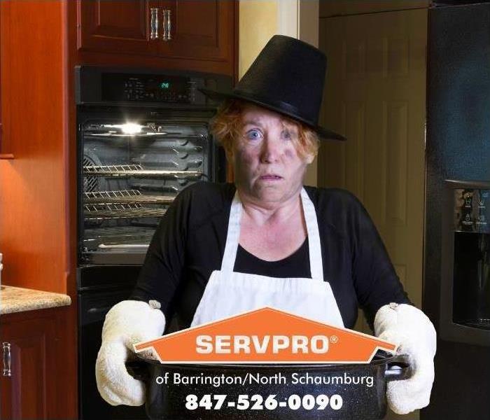 woman holding baking pan 