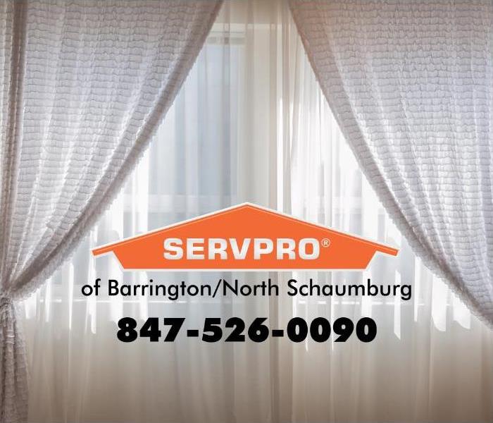 White drapes with a SERVPRO logo in the middle.